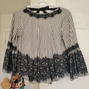 Feminine and airy cotton blouse with tie back detail